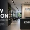 Modern ESTEL Professional salon interior in Saint Petersburg featuring elegant styling stations, premium hair care displays, contemporary design, and a welcoming reception area.